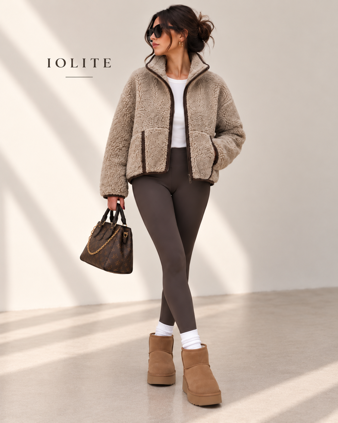 Teddy jacket with two-way front zipper, and front kangaroo pockets with trim detailing.