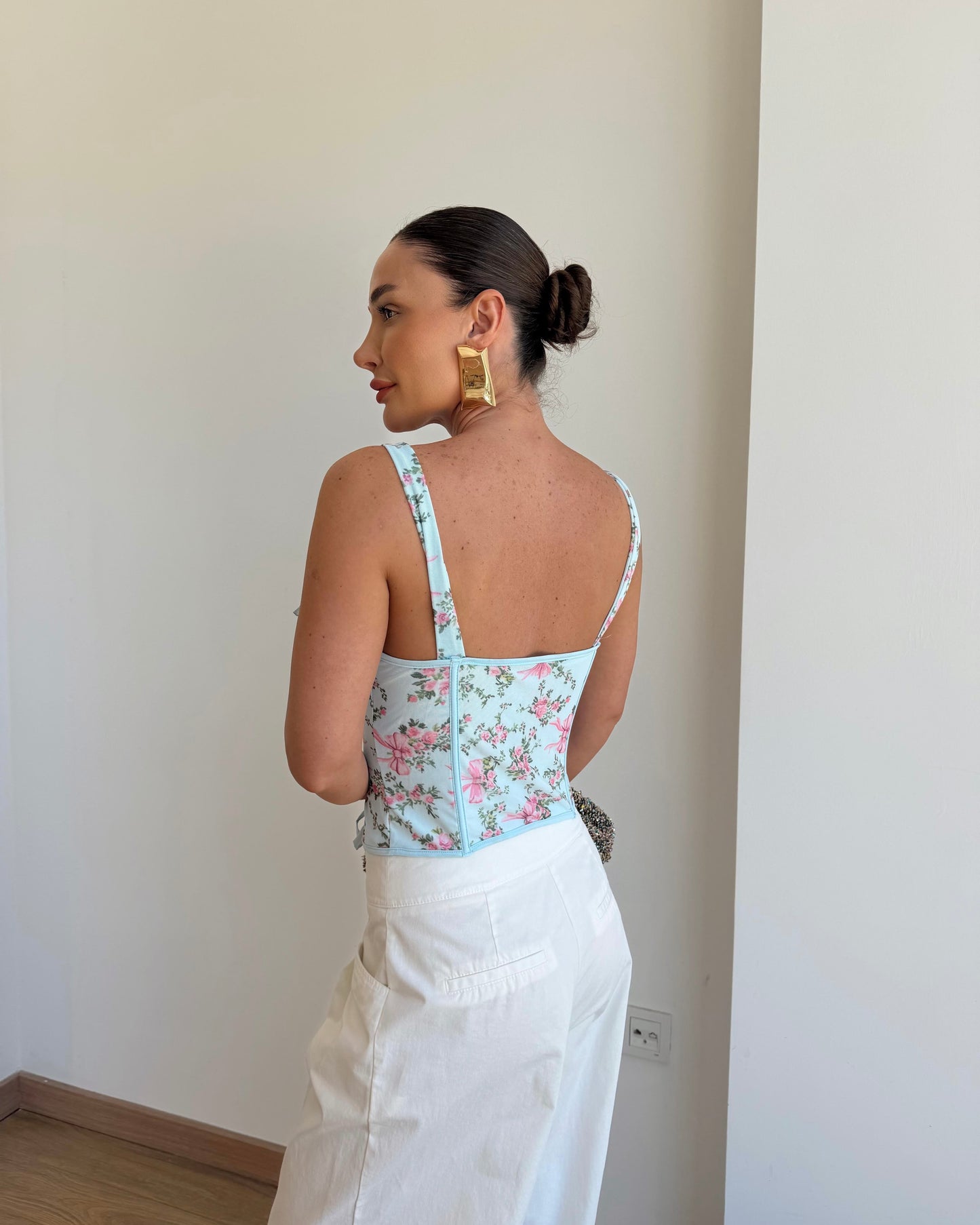 Floral patterned corset blouse.