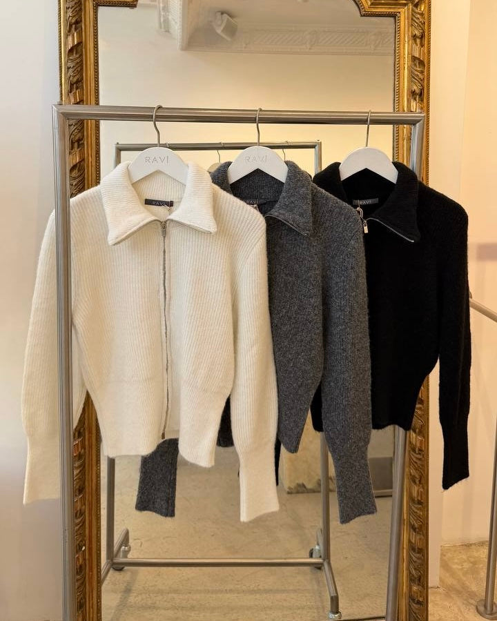 Zip-up cardigan with a wide collar and fitted waist.