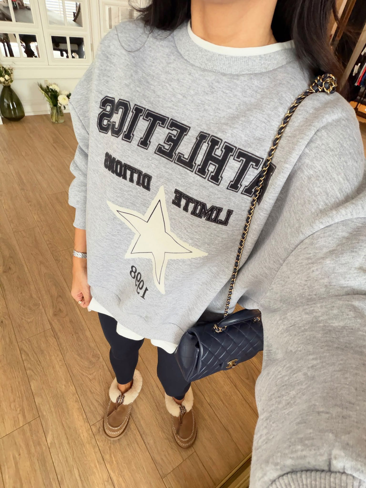 Crewneck sweatshirt with a layered white tee-hem details
