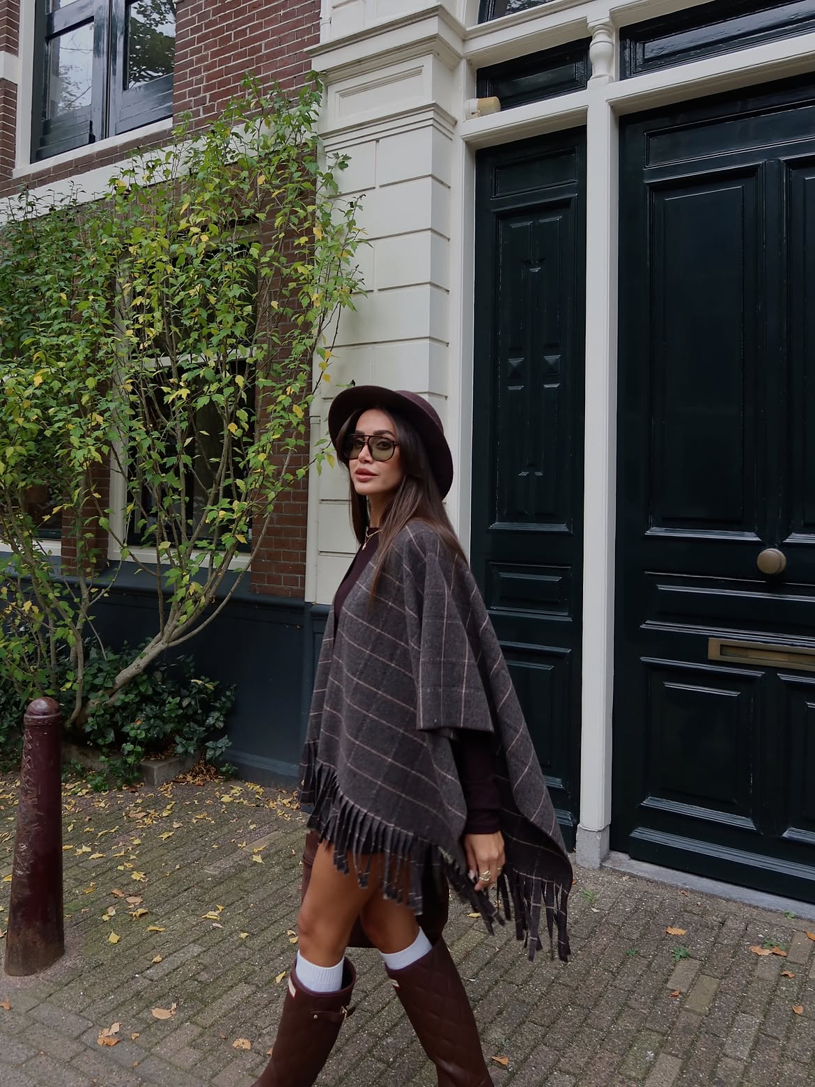 Check-patterned fringe poncho