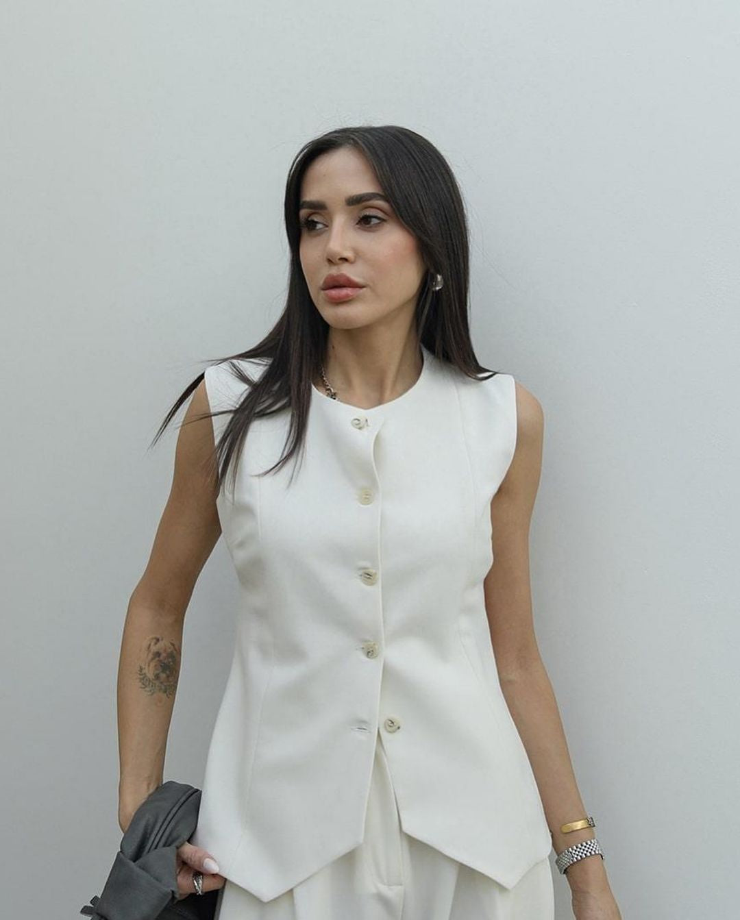 White buttoned vest trouser set.