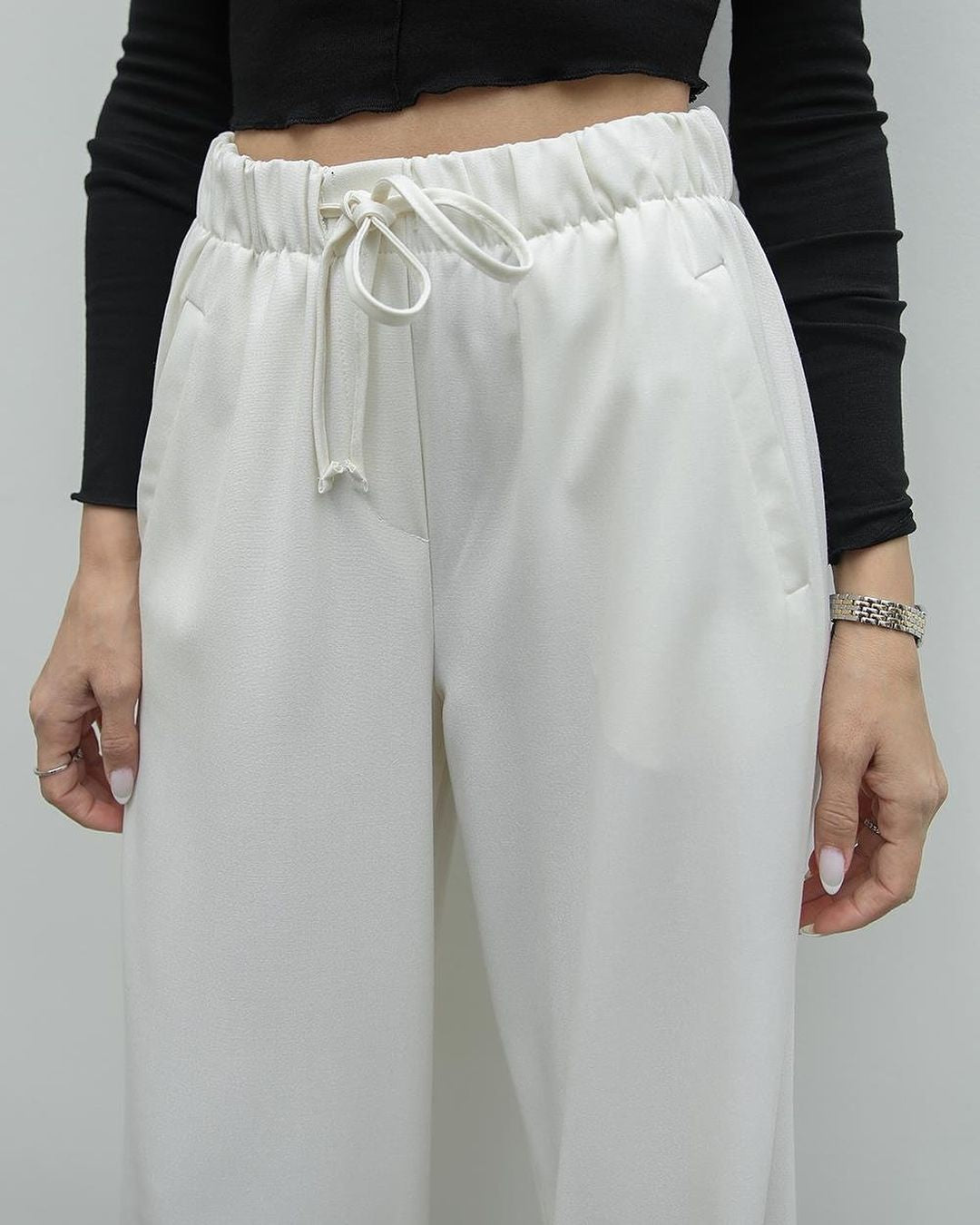 White buttoned vest trouser set.