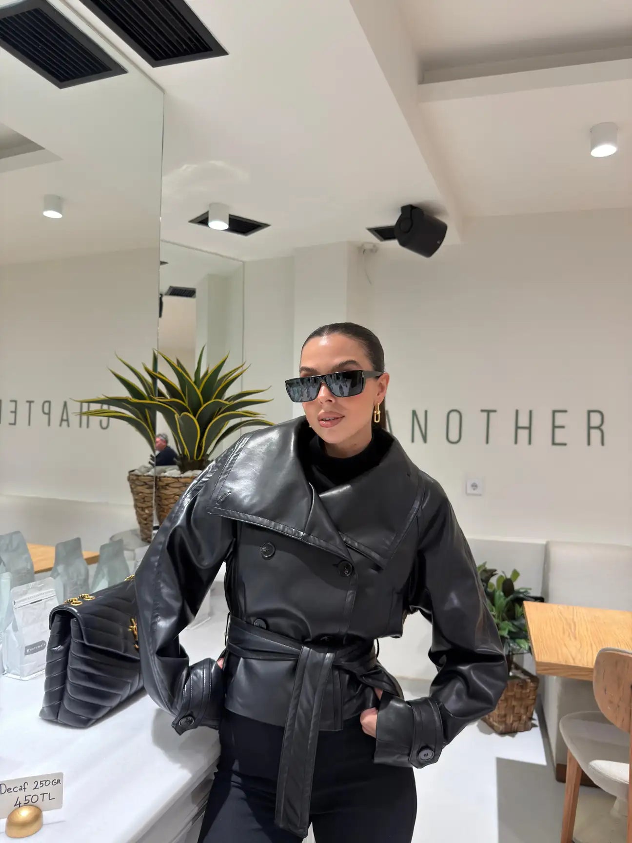 High-collar belted leather jacket