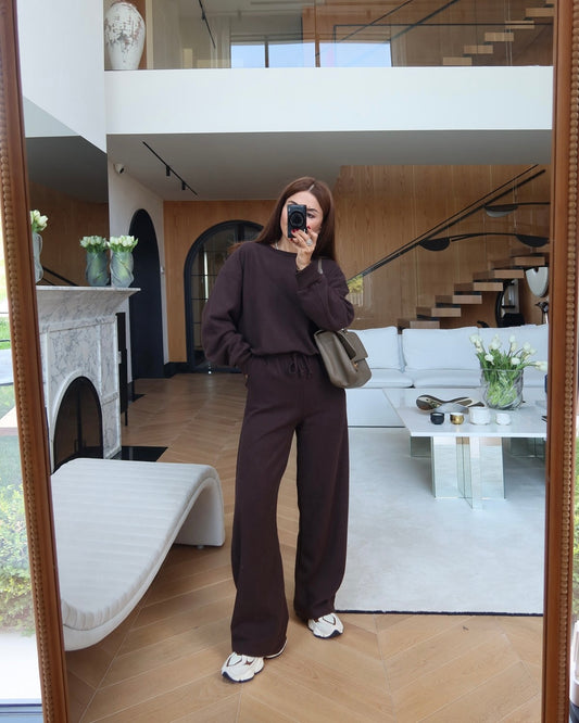 Crewneck sweatshirt paired with comfortable wide-leg trousers.