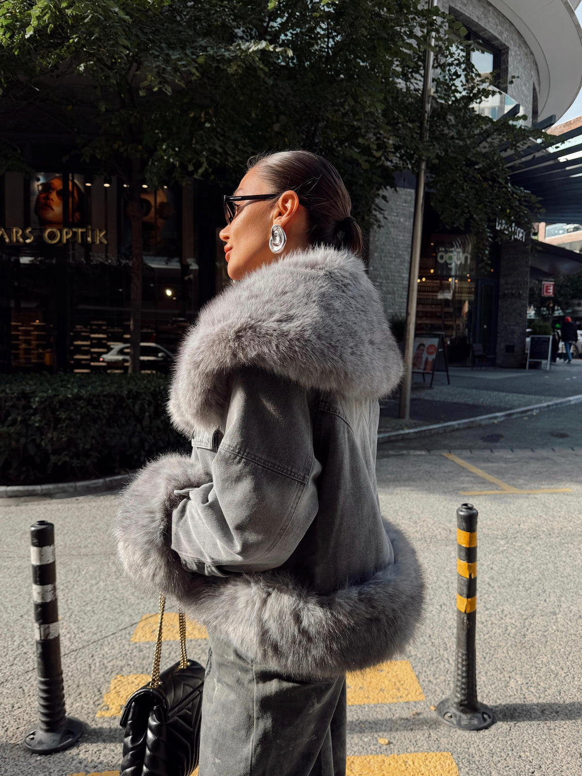 Denim jacket with voluminous faux fur trim on the large collar and cuffs