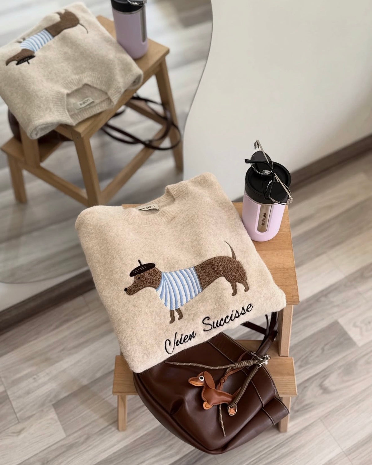 Beige knit sweater with an embroidered dachshund