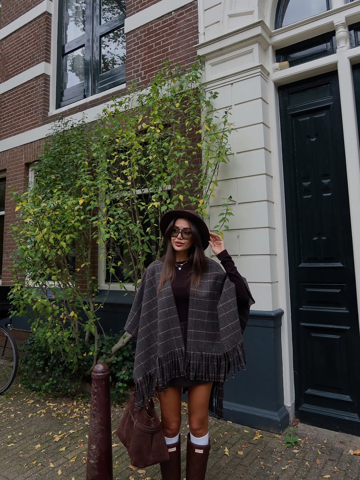 Check-patterned fringe poncho