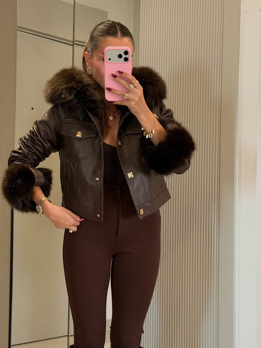Faux-leather short jacket featuring a detachable fur collar and fur cuffs