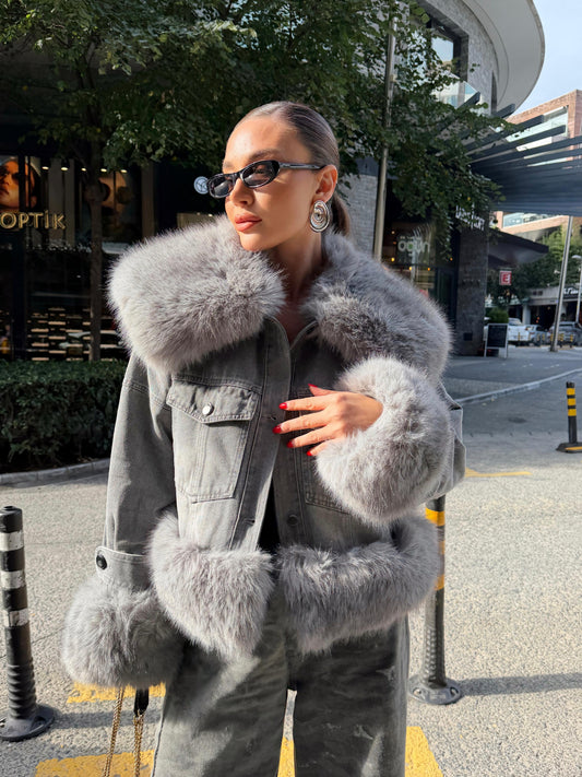 Denim jacket with voluminous faux fur trim on the large collar and cuffs