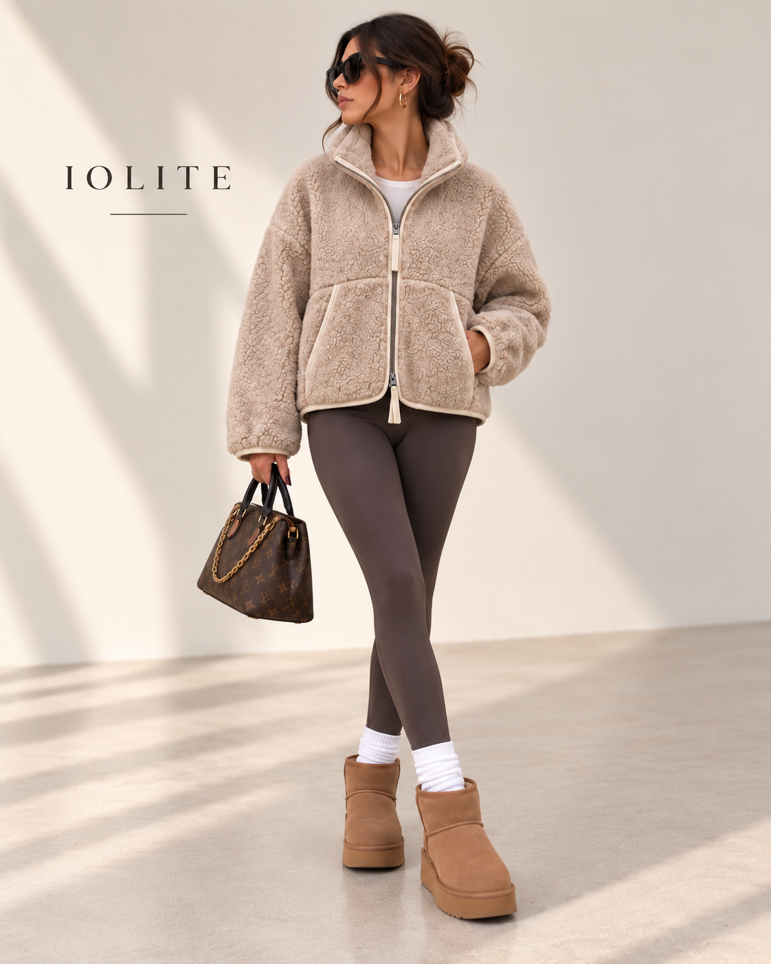 Teddy jacket with two-way front zipper, and front kangaroo pockets with trim detailing.