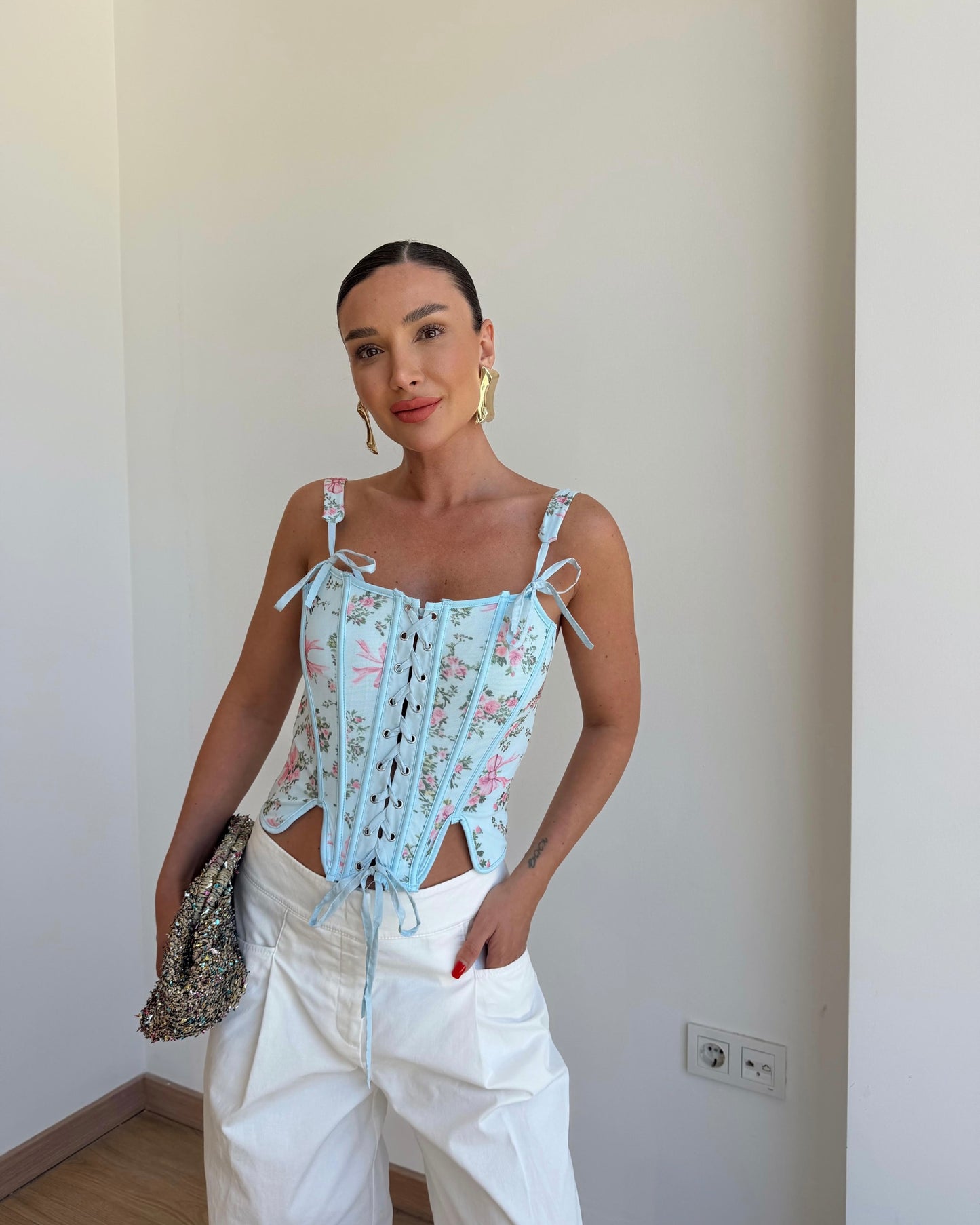 Floral patterned corset blouse.