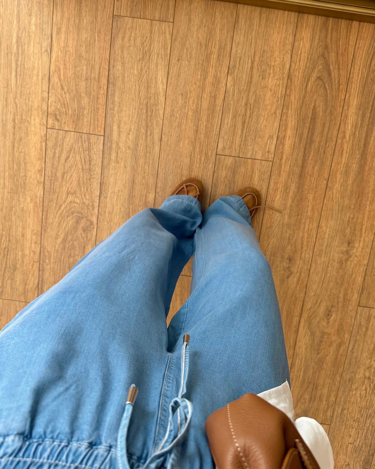 Baggy jeans with decorative pockets and tie-up closure