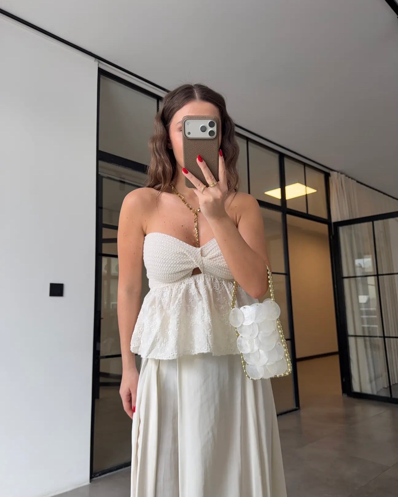 Embroidered knotted strapless blouse