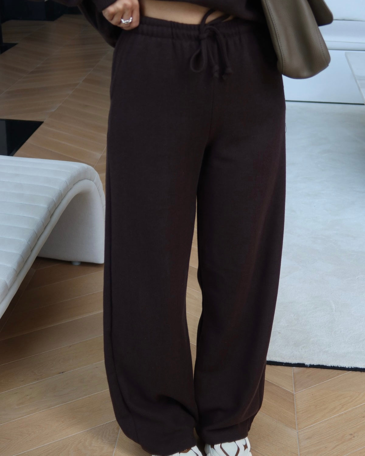 Crewneck sweatshirt paired with comfortable wide-leg trousers.