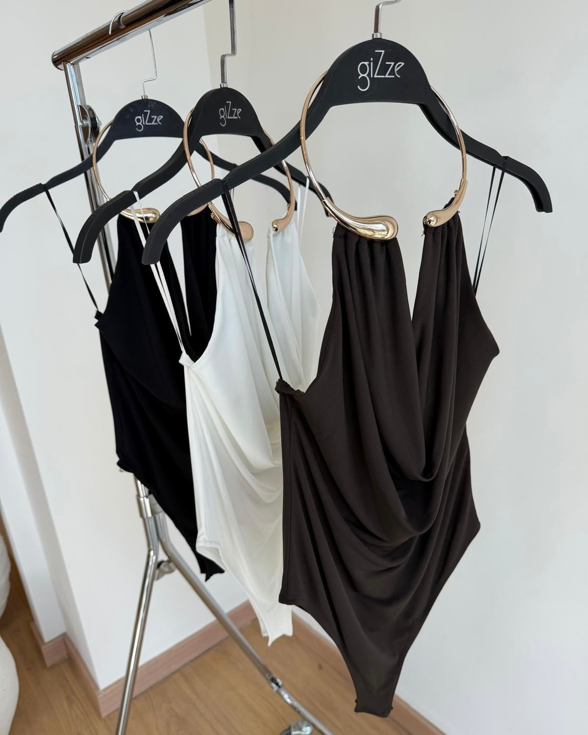 Accessory detailed low-cut bodysuit