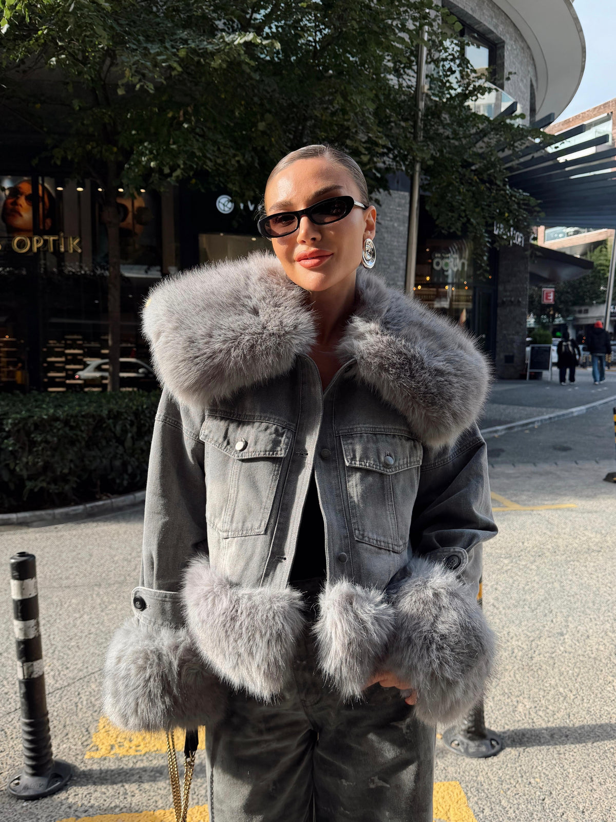 Denim jacket with voluminous faux fur trim on the large collar and cuffs
