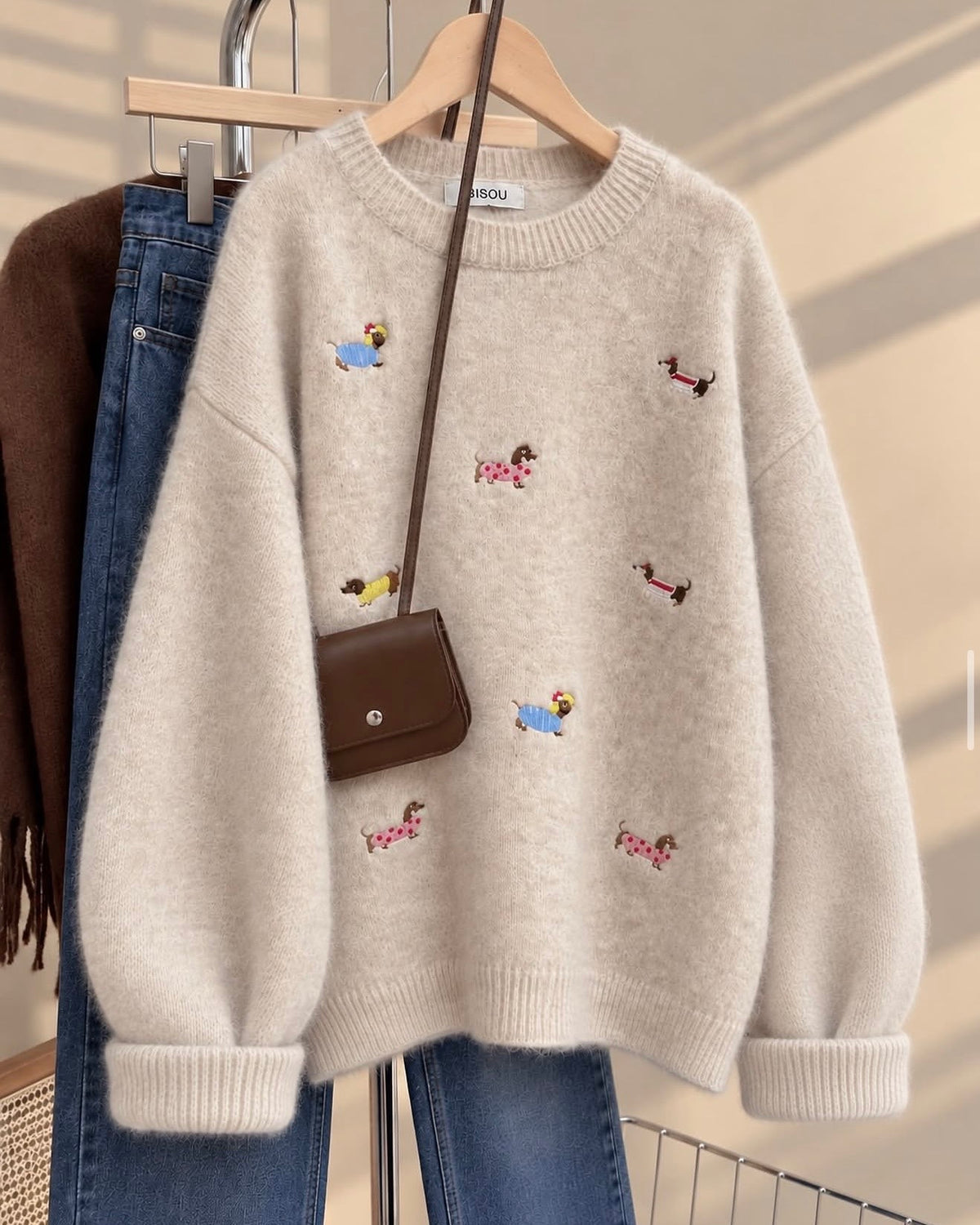 Crewneck sweater features playful little dachshund