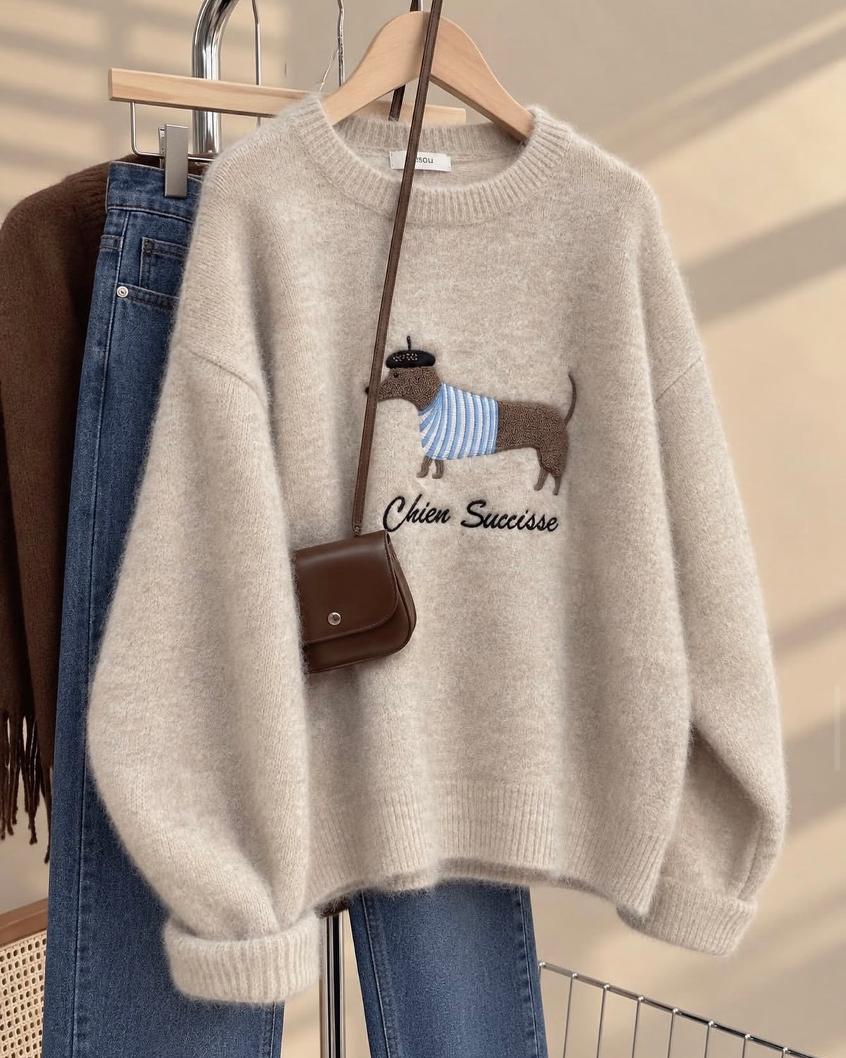 Beige knit sweater with an embroidered dachshund