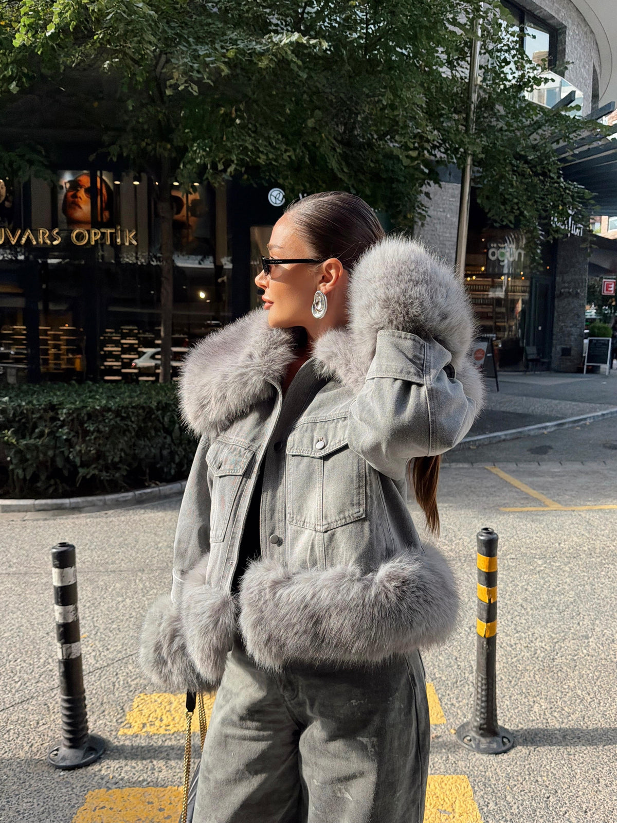 Denim jacket with voluminous faux fur trim on the large collar and cuffs