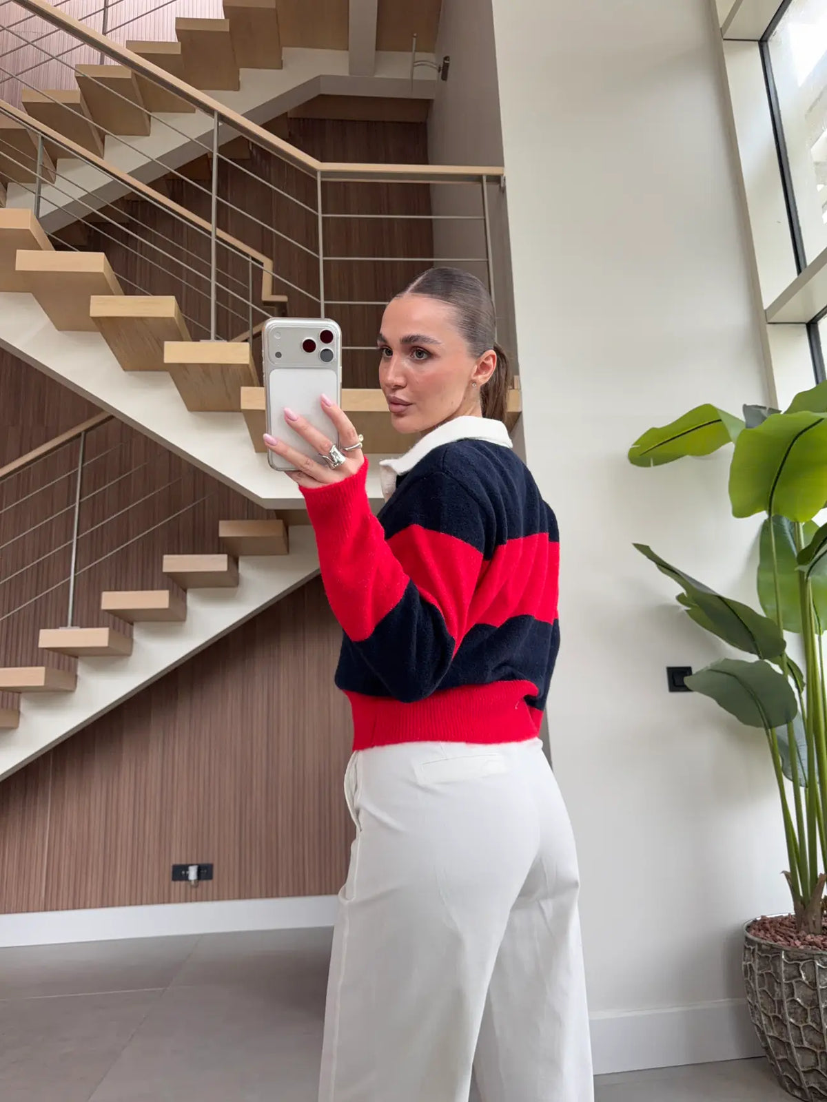 Navy blue and red striped knit polo sweater