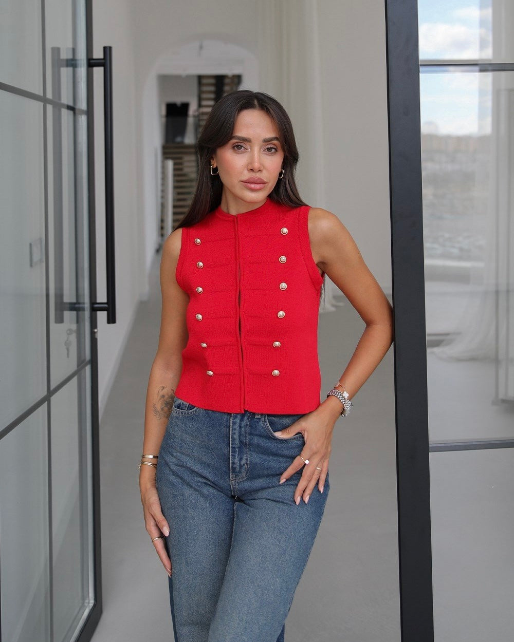 Knitted vest with decorative buttons