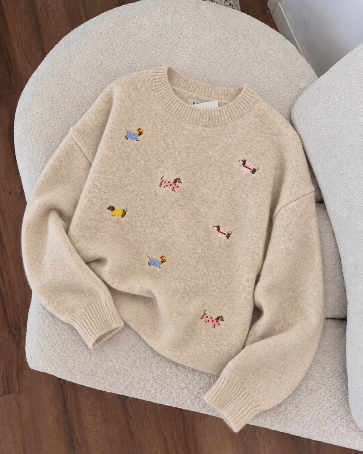Crewneck sweater features playful little dachshund
