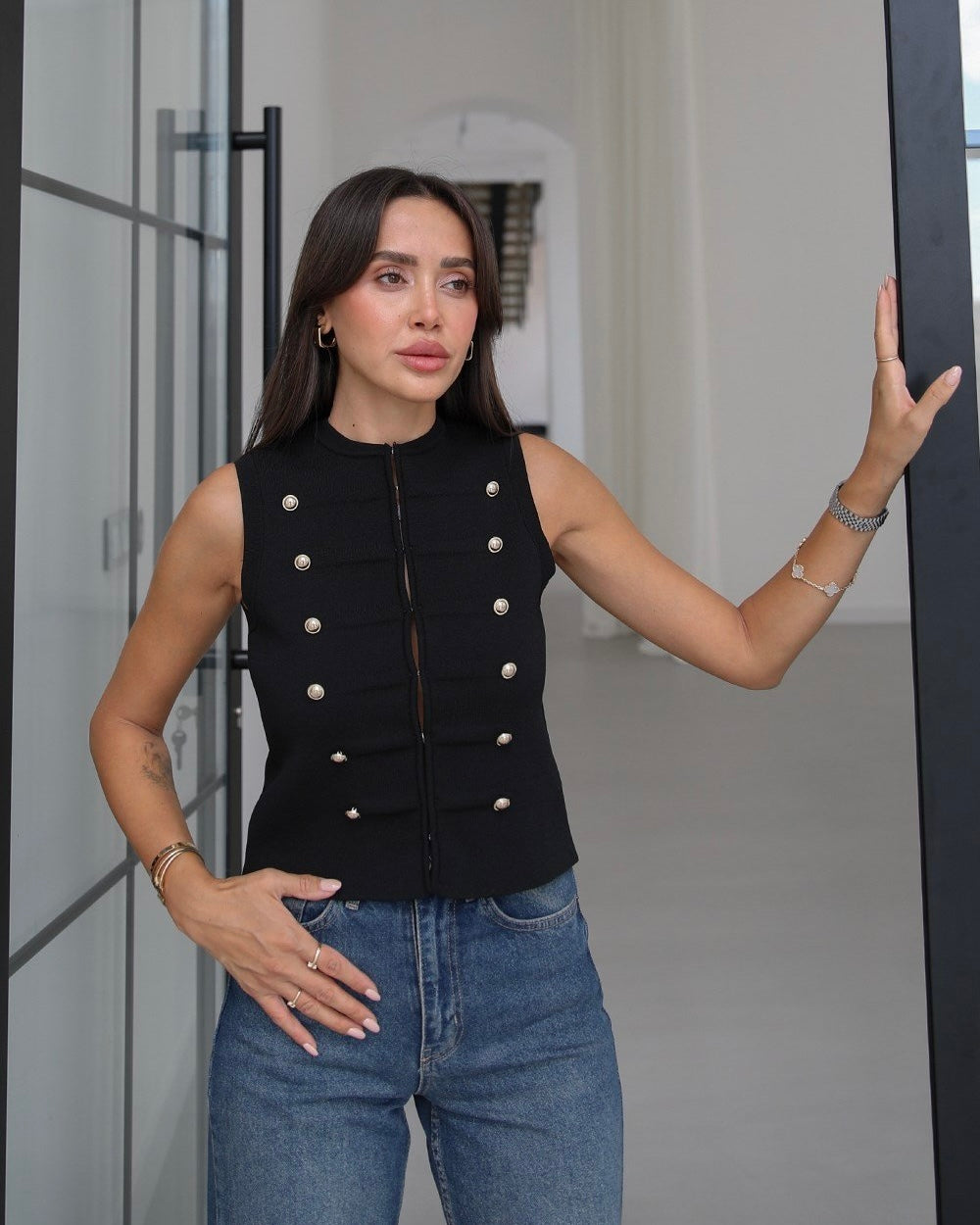 Knitted vest with decorative buttons