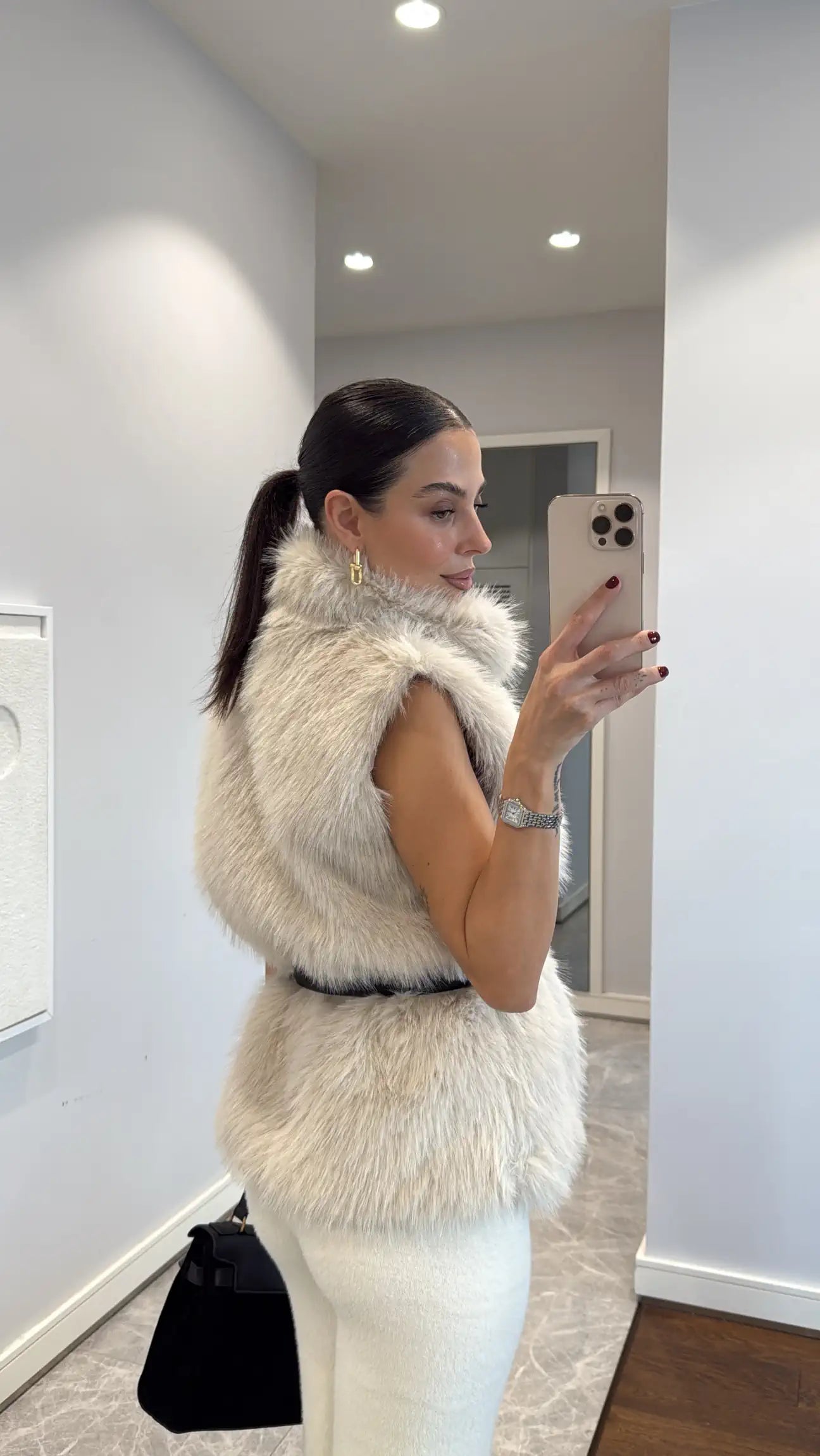 Fur vest with belts