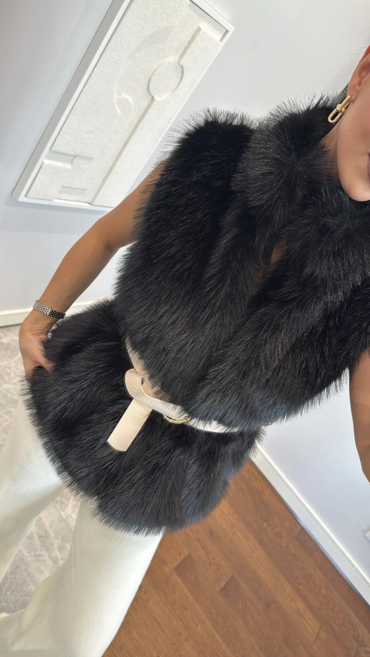 Fur vest with belts