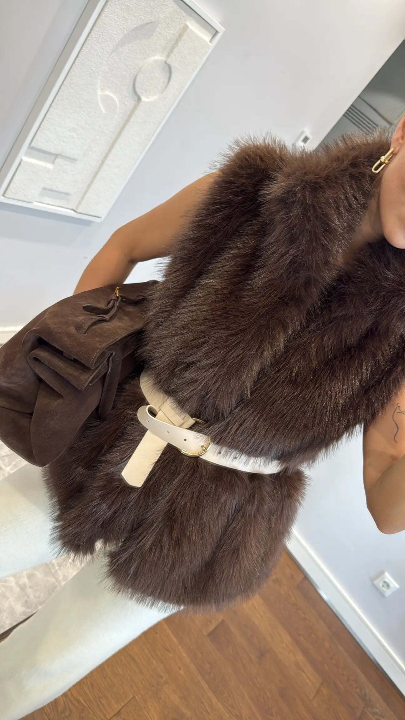 Fur vest with belts